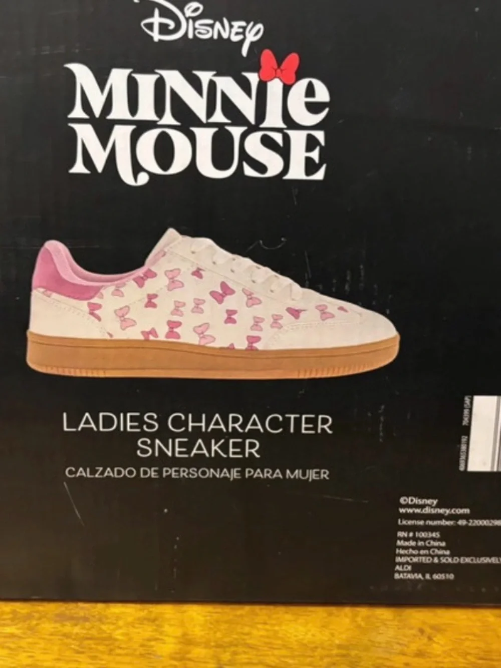 Woman’s Disney Cream Sneakers with Pink Bow Print